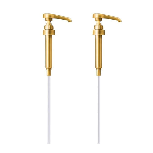 Two gold metal lotion pump dispensers with long white plastic tubes on white background