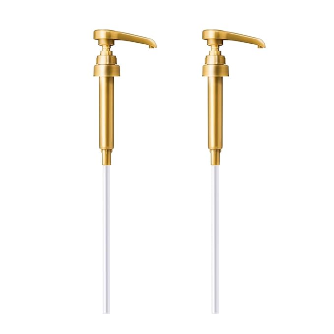 Two gold-colored liquid soap dispenser pumps with long white tubes on a white background