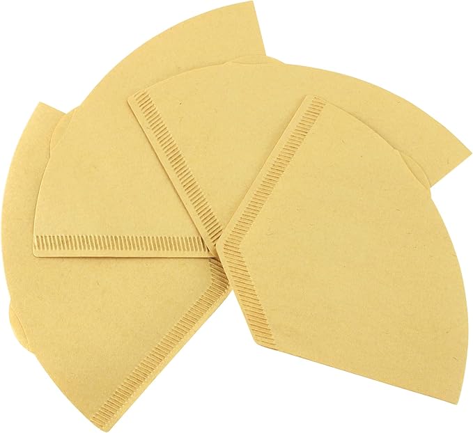 Set of brown paper coffee filters arranged in a fan shape on a white background