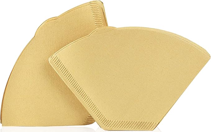 Two brown disposable paper coffee filters on a white background